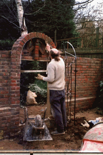 Hard landscaping is one of our specialities.Building this arcway for a wrought iron entrance gate is a good example